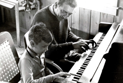 Historical Picture of Clive Robbins working with a Child