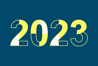 Image captures a navy blue square shaped graphic, with horizontal text in the middle. The blue, gold, and white colored text is a set of 4 numbers, making up the calendar year "2023".