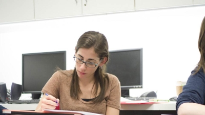 Doctoral students with computers