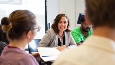 Professor Carol Anne Spreen with undergraduate students