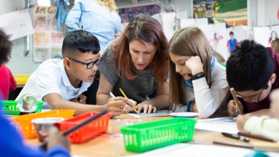 Student with kids in classroom