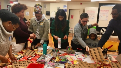 Student working on project with kids