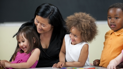 Three children with a teacher