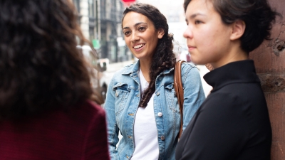 Three students in the Department of Applied Statistics, Social Science, and Humanities talking