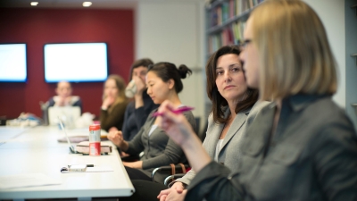 Students sitting at a conference table.