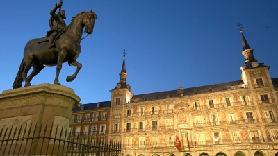 Statue in a square at night