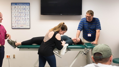 Faculty and students in a physical therapy class