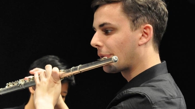 A student playing the flute.