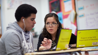Teacher working with student