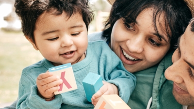 Parents playing with child