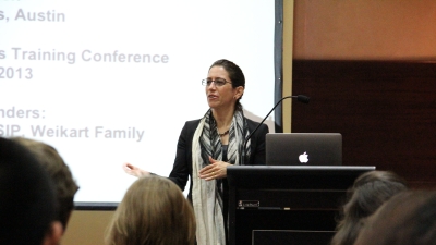 Dr. Dana Burde delivering a speech