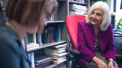 A professor speaking with a student.