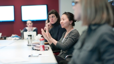 Students sitting at a conference table.
