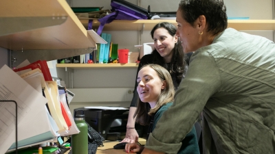 faculty and students talking