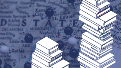 Two piles of books atop a U.S. map
