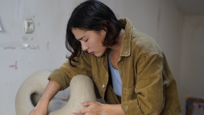 Student with clay work.