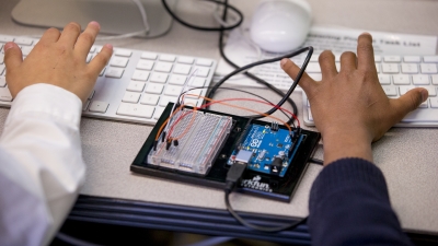 children coding on a keyboard