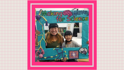 Family wearing EEG helmets and smiling