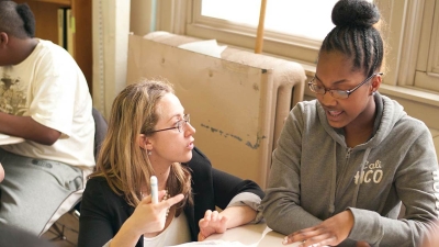 Researcher working with a Student