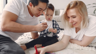 Parents coloring with their young child