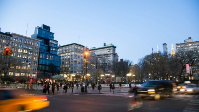 Twilight at Union Square with taxi cabs whizzing by