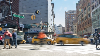 Taxi cabs speeding by on lower Broadway between Union square and Washington Square