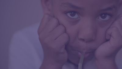 Young student sipping on straw