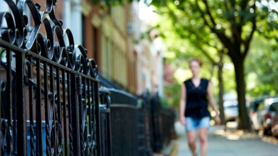 Graduate student walking along Washington Square North