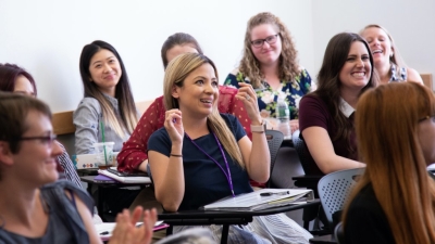 A group of women at classroom desks