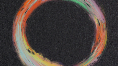 A multicolored circle on a black background from the cover of Creative Infrastructures