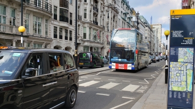 A busy one-way road filled with cars on the busy streets of London's St.James Neighborhood