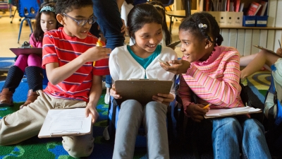 Third graders discuss possible ways to solve a new math problem.