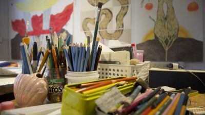 A bunch of colored pencils in a studio.