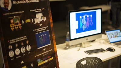 presentation poster and computer with demo