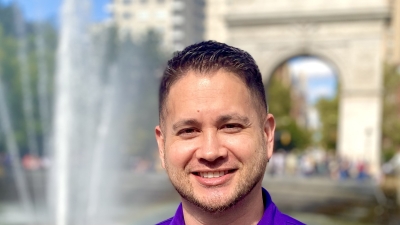 headshot of David in front of fountain