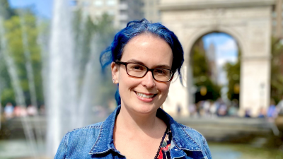 headshot of Trish in front of fountain