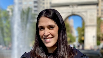 Headshot of Kimberly in front of fountain
