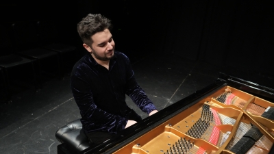 NYU piano student playing steinway grand piano