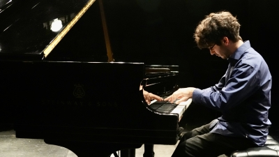 NYU student playing Steinway grand piano