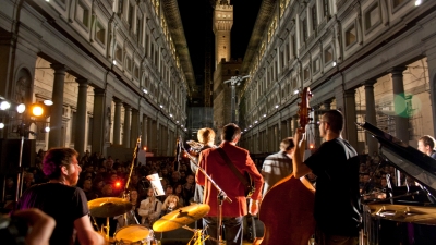 jazz group playing outdoors with city view