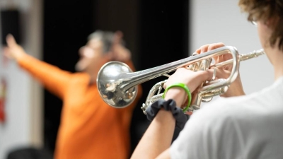 NYU student playing trumpet