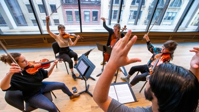 NYU Violinists practicing in Paulson Center
