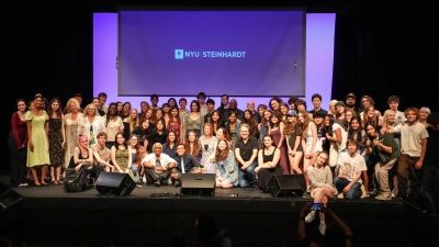 NYU Songwriting summer program posed on stage for group photo