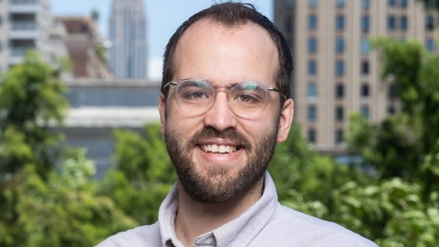 man with glasses smiling