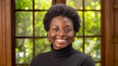 woman with glasses smiling