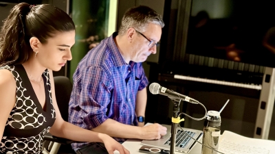 Screen Scoring student and professor working at table