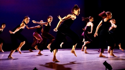 Master's students from the Dance Education program rehearsing on stage for upcoming show
