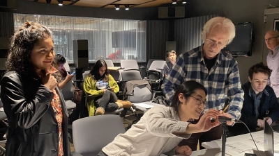 Group of students and a professor working in the screen scoring studio