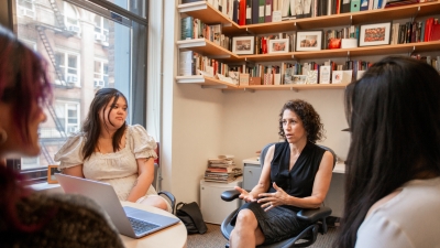 Professor Dana Burde engaging in conversation with students