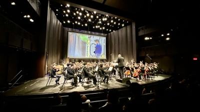 Orchestra playing in Iris Cantor Theatre